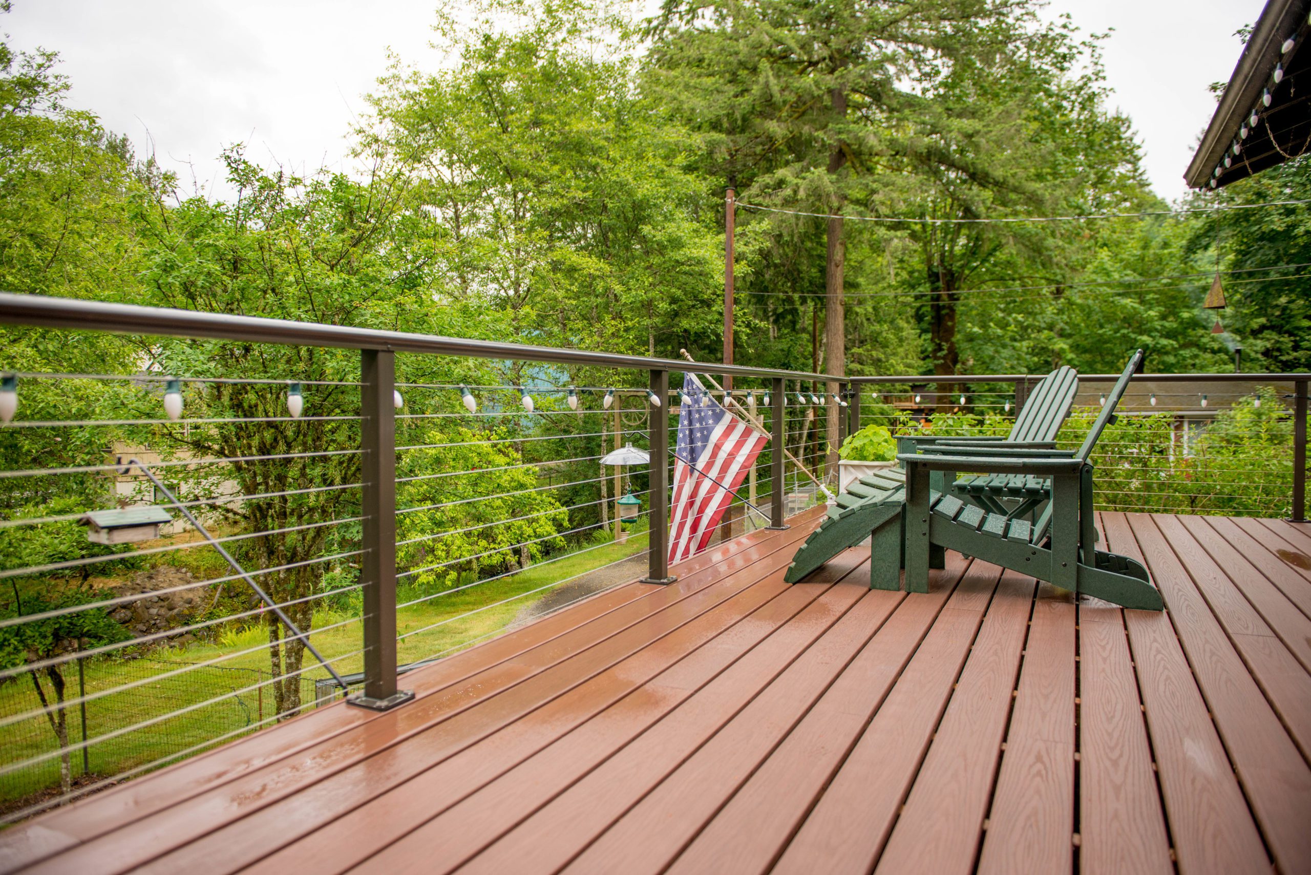 Lifestyle_composite_armadillo_decking_001 Scene of a wet afternoon out on a composite armadillo deck