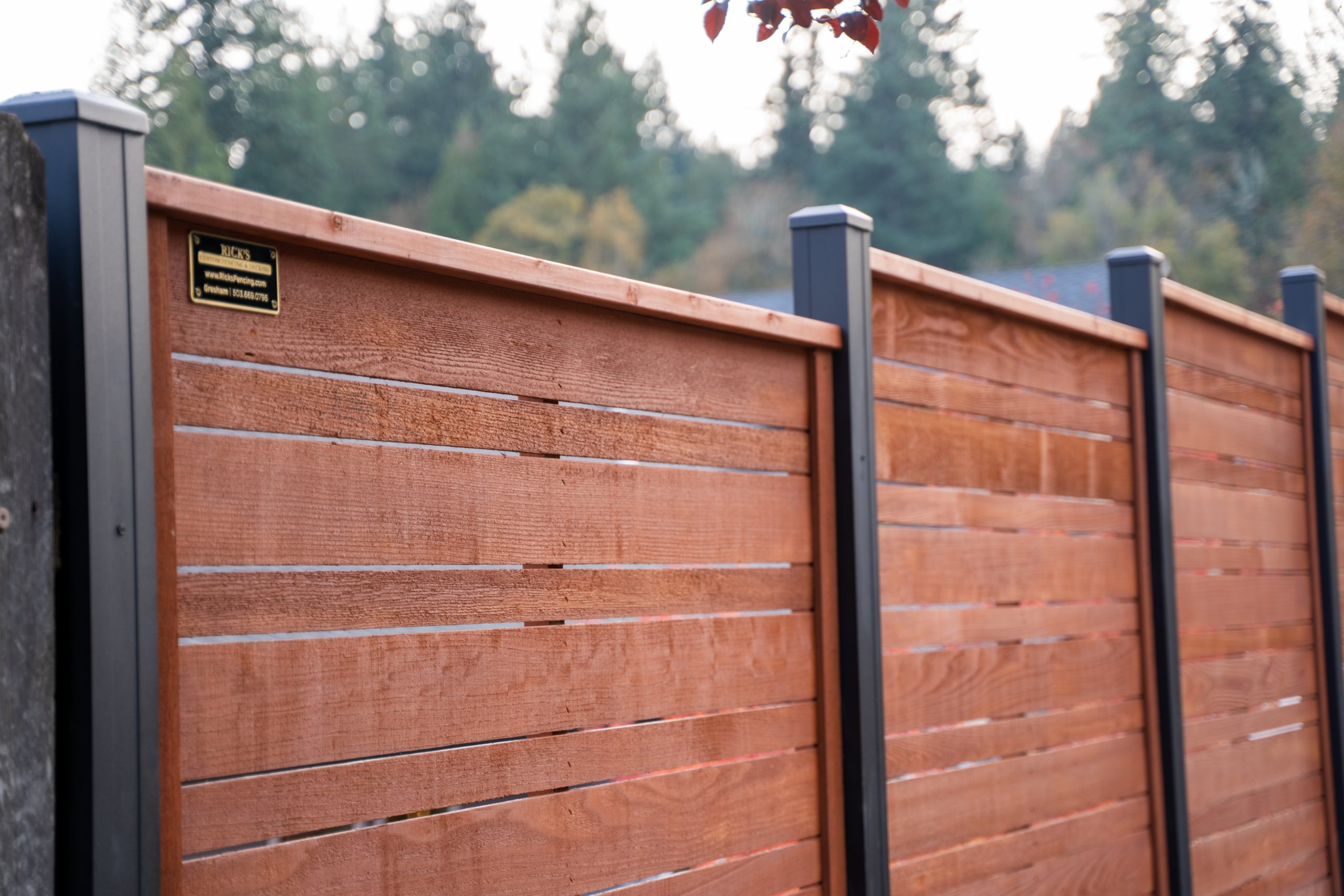 stained horizontal fence with aluminum posts