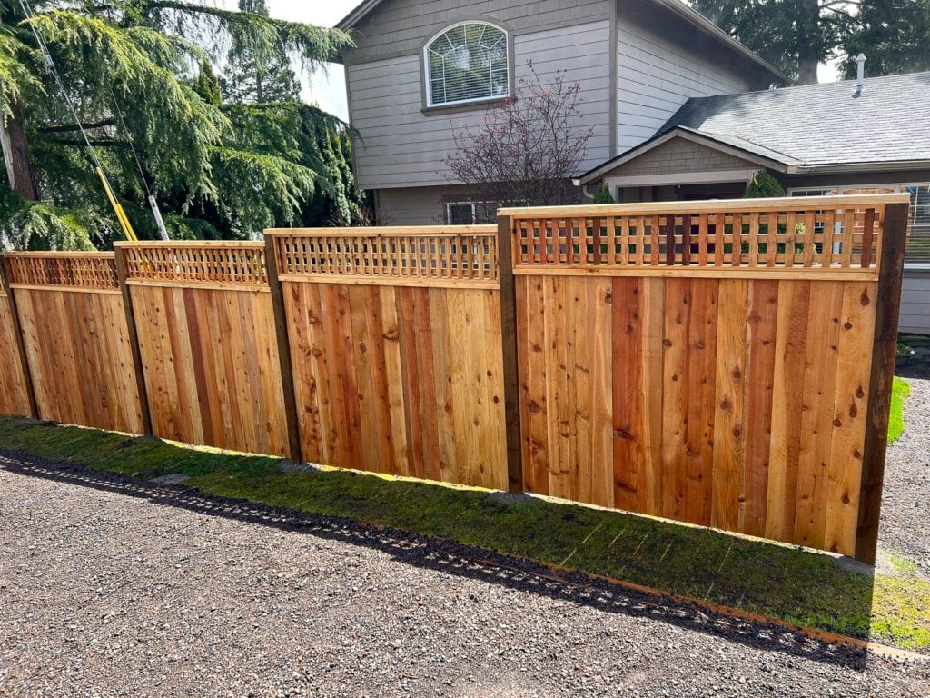 A square lattice top fence in front of a house.