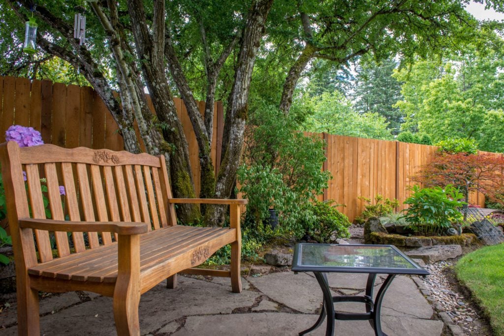 1014 Cedar Solid Style Fencing Stained solid fence in a backyard