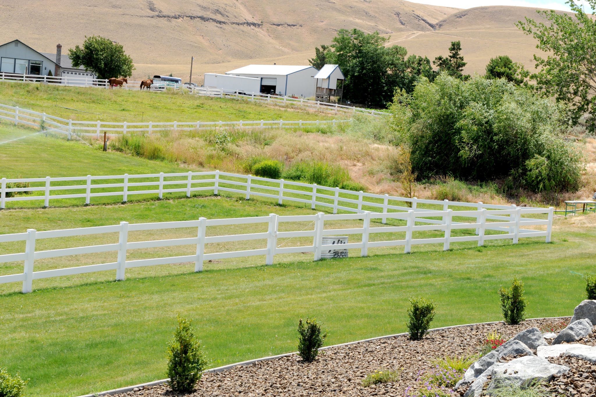 Vinyl Pasture Rail Fence built by Rick's Custom Fencing and Decking