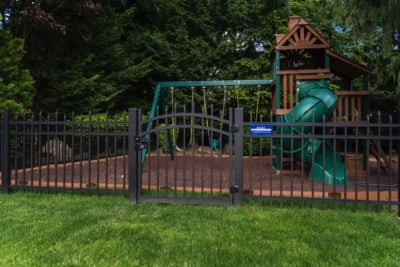 1075 Regis Aluminum Fencing Aluminum Fencing in front of a play structure