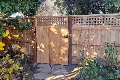 1029 Fencing Cedar Lattice Top A lattice top with with a gate and stone path running through it.