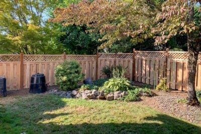 1030 Fencing Cedar Lattice Top A diagonal lattice top fence wrapping around a yard.