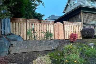 1042 Fencing Cedar Lattice Top A cedar lattice top fence with a gate.