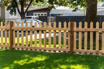 1001 Fencing Cedar Picket The backside of a wood picket fence.