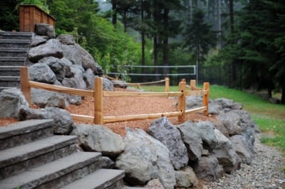 1007 Cedar Split Rail Fencing Cedar Split Rail Fencing making a boundary next to steps.