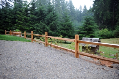 1011 Cedar Split Rail Fencing Cedar split rail fencing in gravel.
