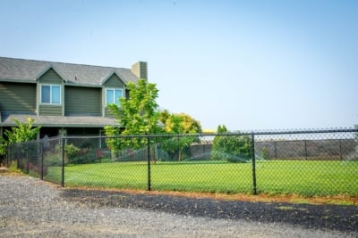 1052 Chain Link Fencing Black Chain Link Fencing around front yard of home.