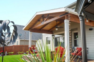 1105 Covers Wood Framed A wooden gable patio cover painted while in a backyard.