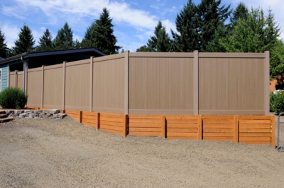 1000 Retaining Walls Retaining Wall under a vinyl fence